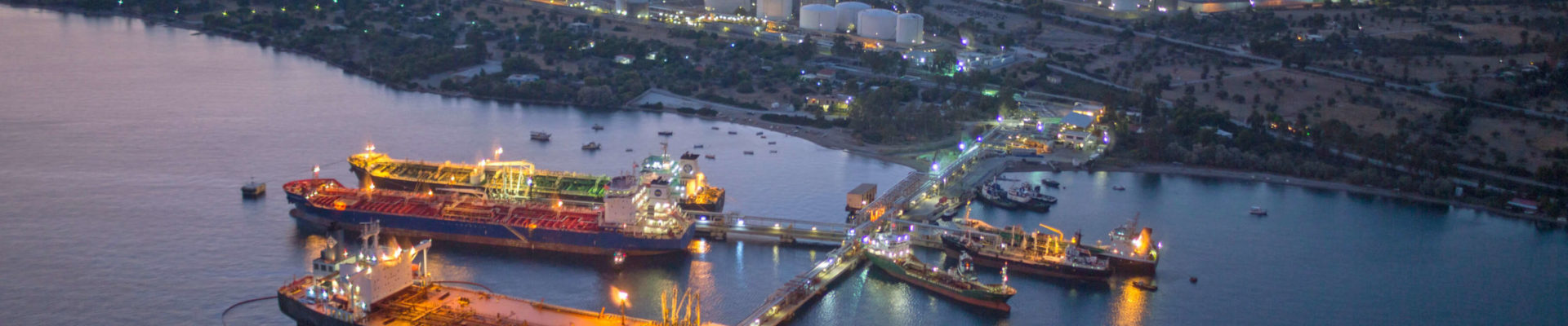 Illuminated oil refineries at night