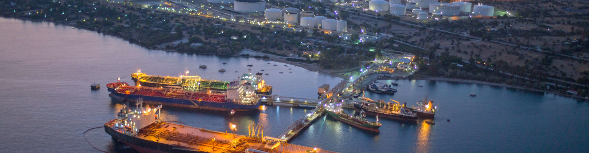 Illuminated oil refineries at night