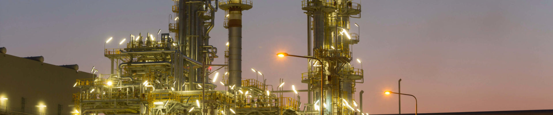 Illuminated oil refineries at night