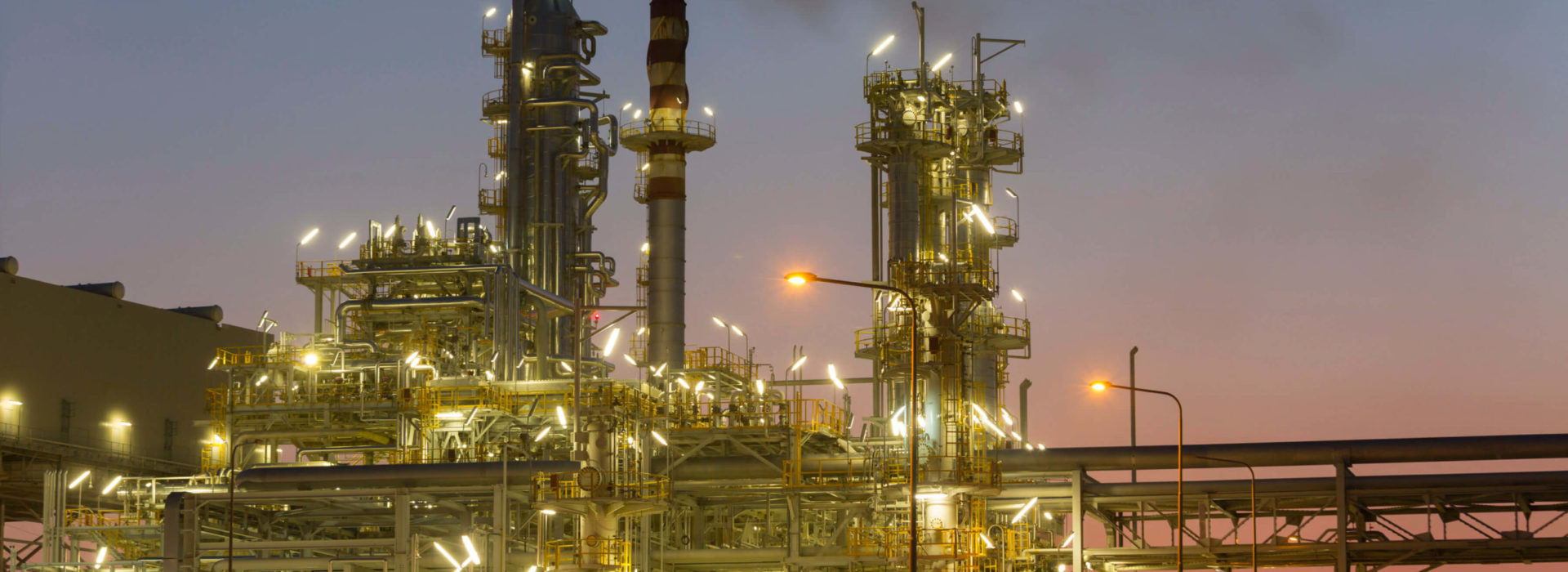 Illuminated oil refineries at night